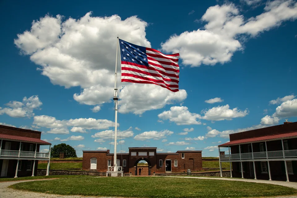 American flag above the historic entrance to Fort McHenry in Baltimore